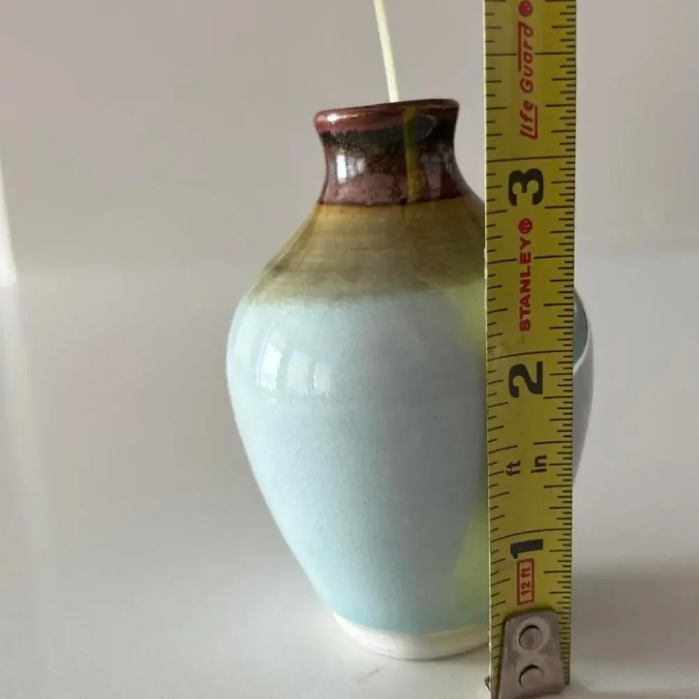 Signed studio pottery bud vase with pale blue celadon-style glaze